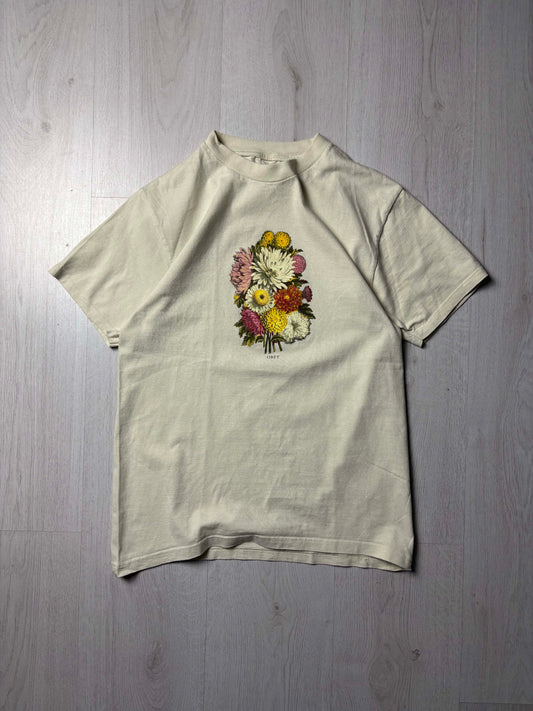 Off white Obey T-shirt met bloemenprint in maat Small, kleurrijke streetwear voorkant, verkrijgbaar bij Redressed.

