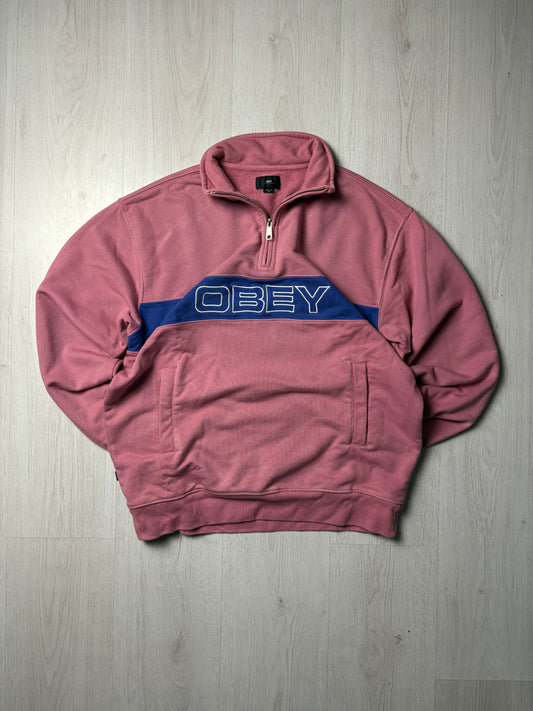 Roze Obey zip-up sweater in maat Medium, opvallende en comfortabele streetwear stijl, verkrijgbaar bij Redressed.